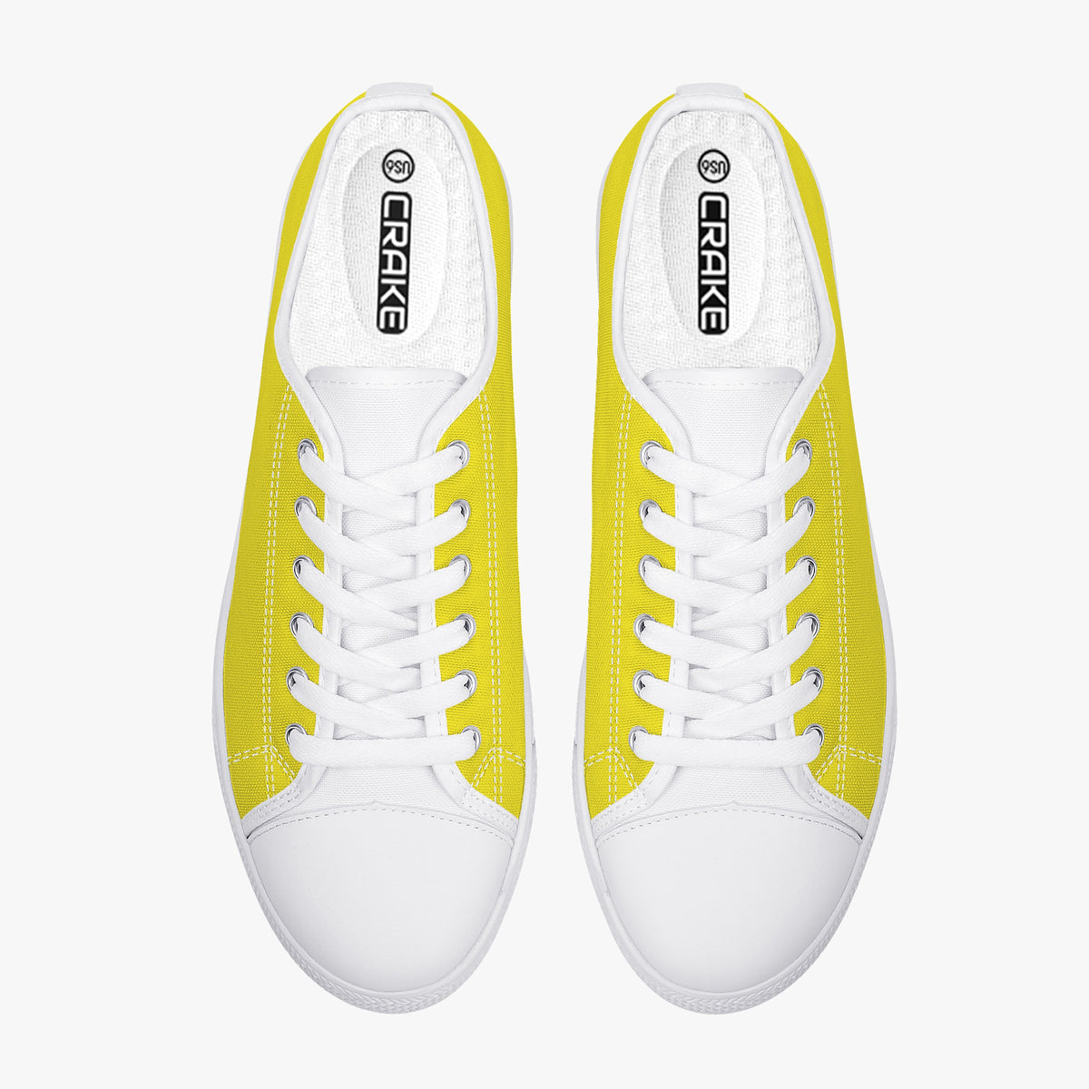 Top view of Crake Low Top Yellow Sneaker pair with white laces