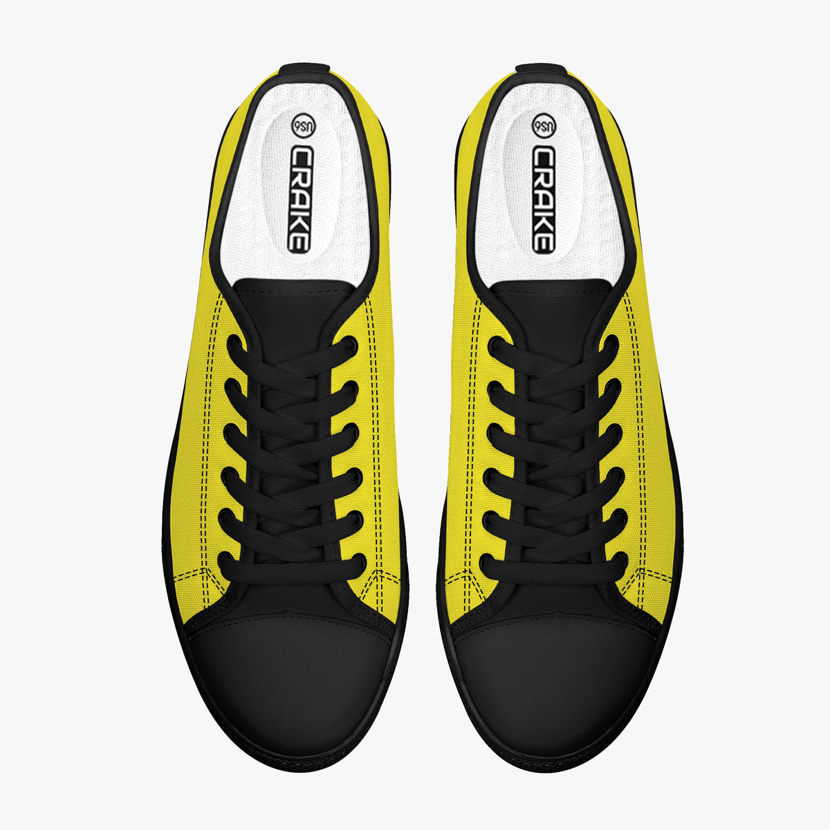 Top view of Crake Low Top Yellow Sneaker pair with black laces