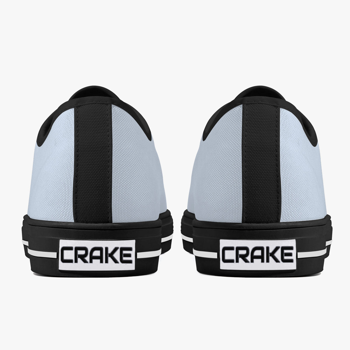 Rear view of Crake Low Top Silver pair with black heel stripe and Crake logo