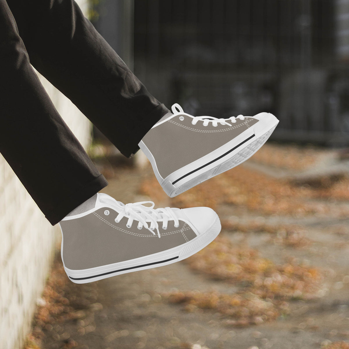 Crake High Top Mushroom Grey Sneaker with white trim worn with dark trousers outdoors