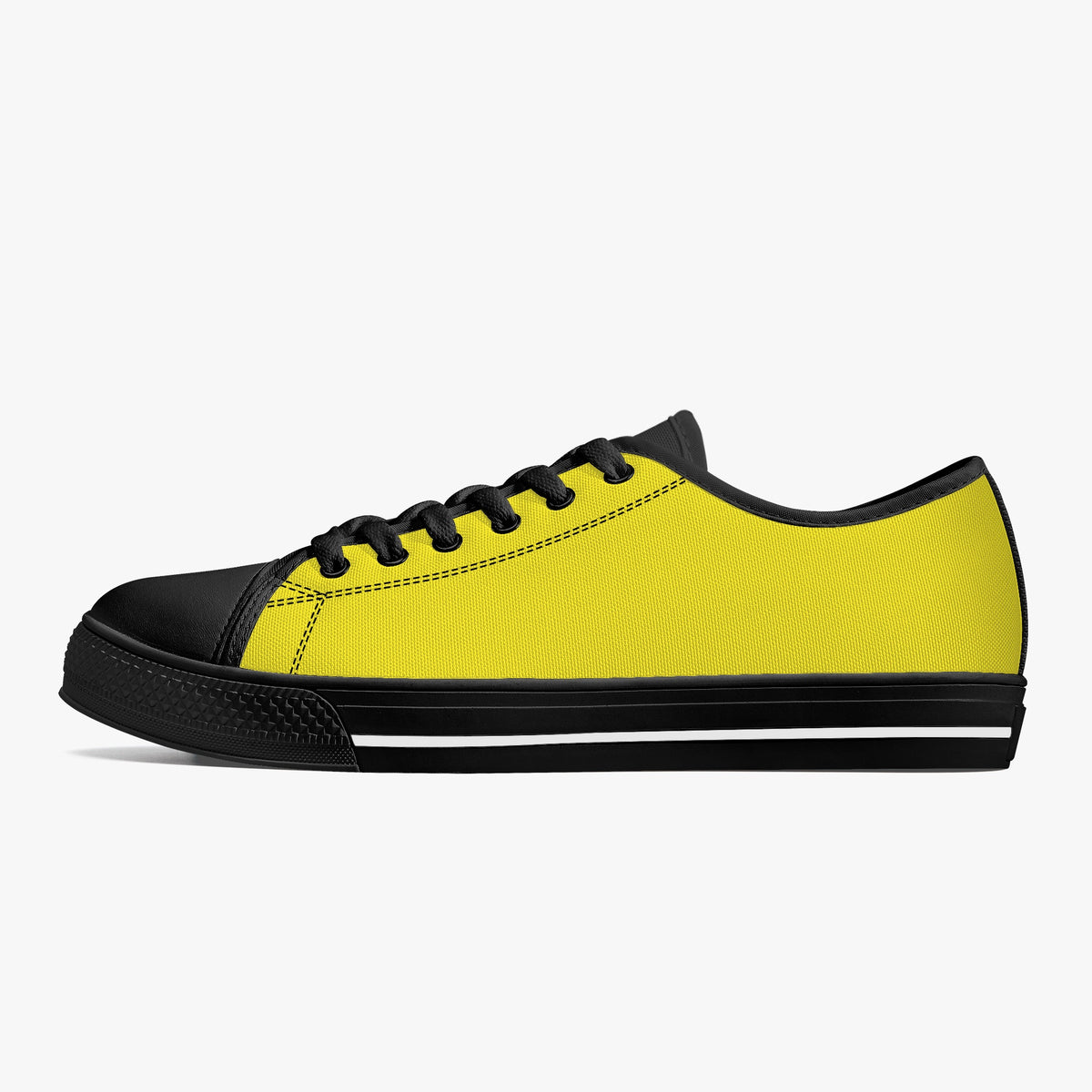 Crake Low Top Yellow Sneaker with black toe cap and sole, side view