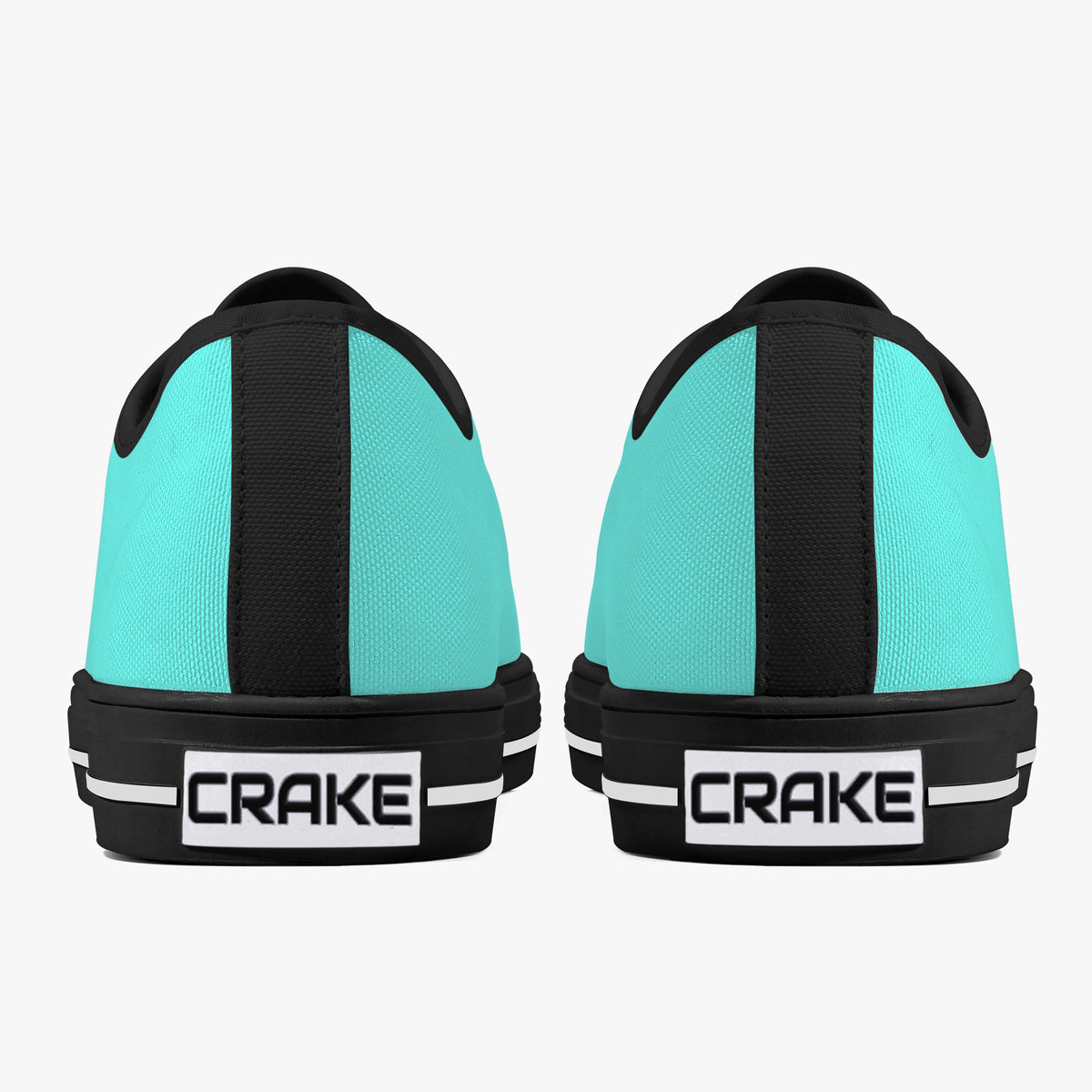 Rear view of Crake Low Top Teal Sneaker pair with black heel stripe and Crake logo