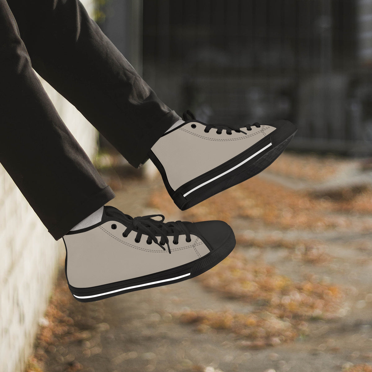 Crake High Top Mushroom Grey Sneaker with black trim worn with dark trousers outdoors