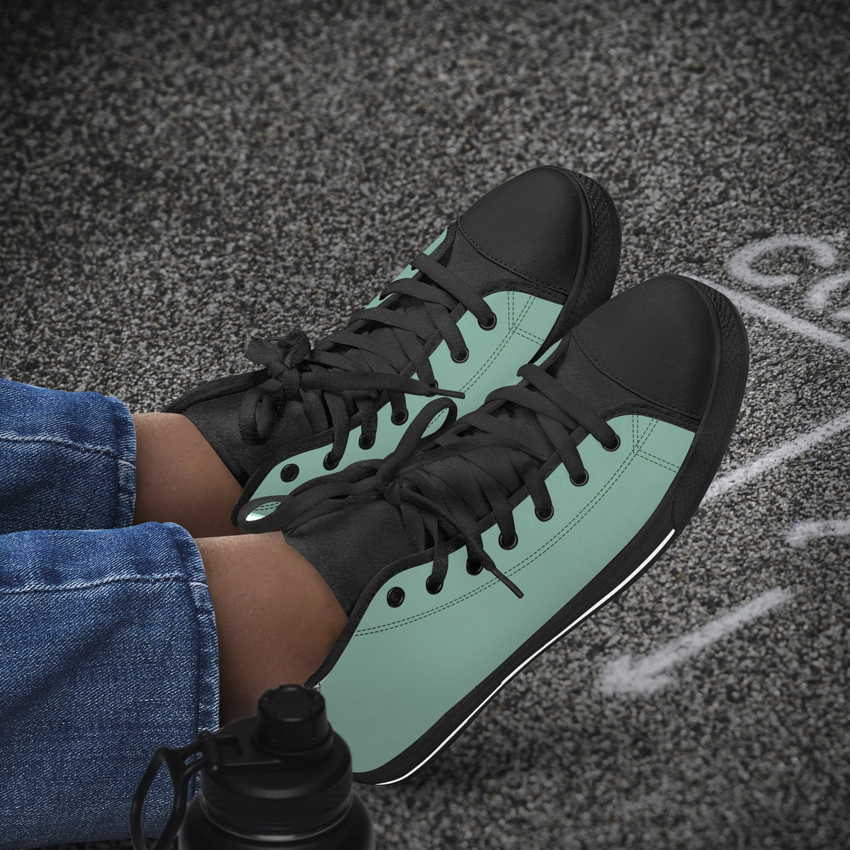 Crake High Top Mint Sneaker with black trim worn with jeans outdoors