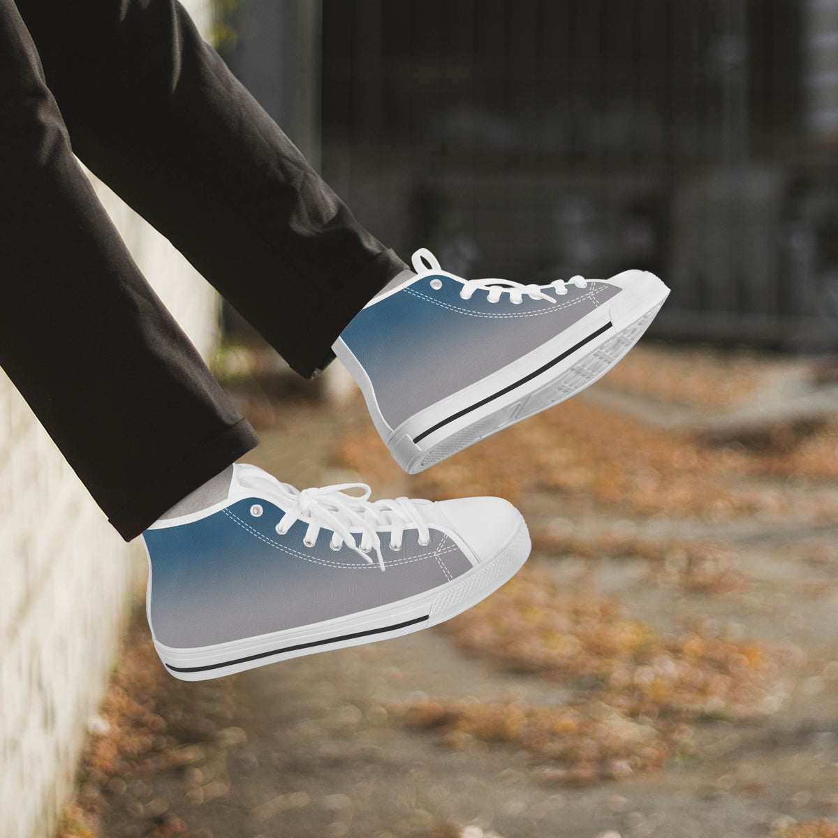 Crake High Top Sky Sneaker with white trim worn with dark trousers outdoors
