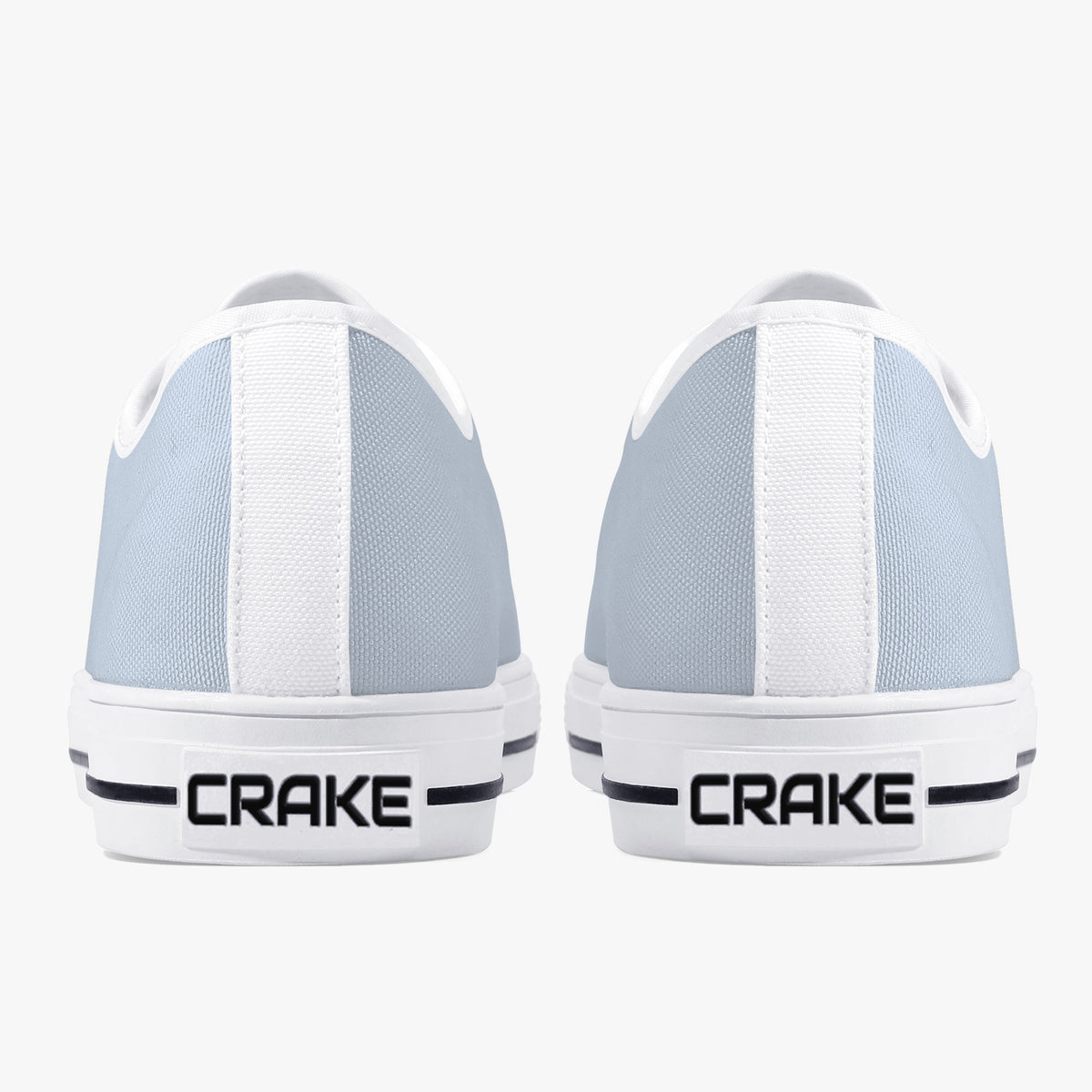 Rear view of Crake Low Top Silver pair with white heel stripe and Crake logo